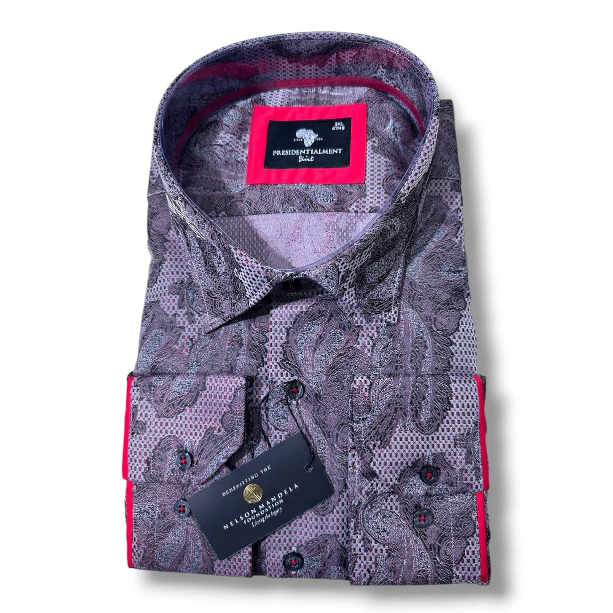 a neatly folded men's Presidential floral shirt in rich shades of dusty lavender and tropical violet accents with an intricate paisley pattern. The shirt is labelled "Presidential Premium Quality" and is displayed against a plain white background.