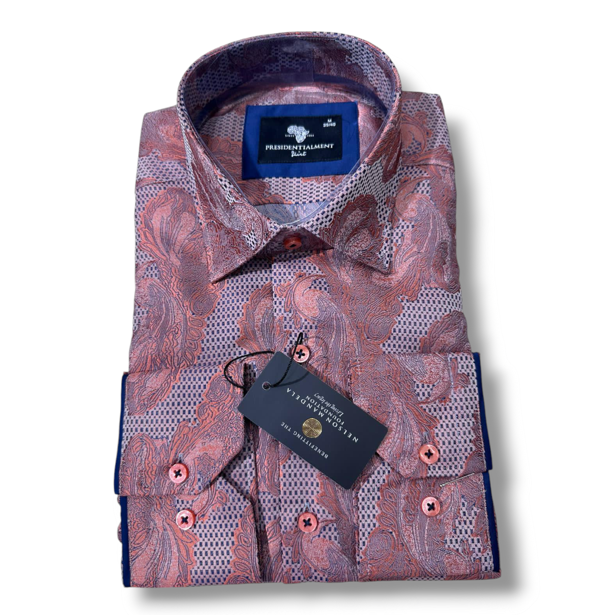 a neatly folded men's Presidential dress shirt in rich shades of coral and mauve intricate paisley pattern. The shirt is labelled "Presidential Premium Quality" and is displayed against a plain white background.
