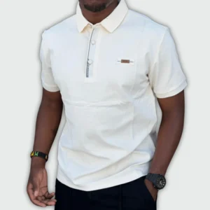 Man wearing a cream white cotton polo t-shirt with short sleeves, slim fit design, classic collar, and button placket for smart-casual wear