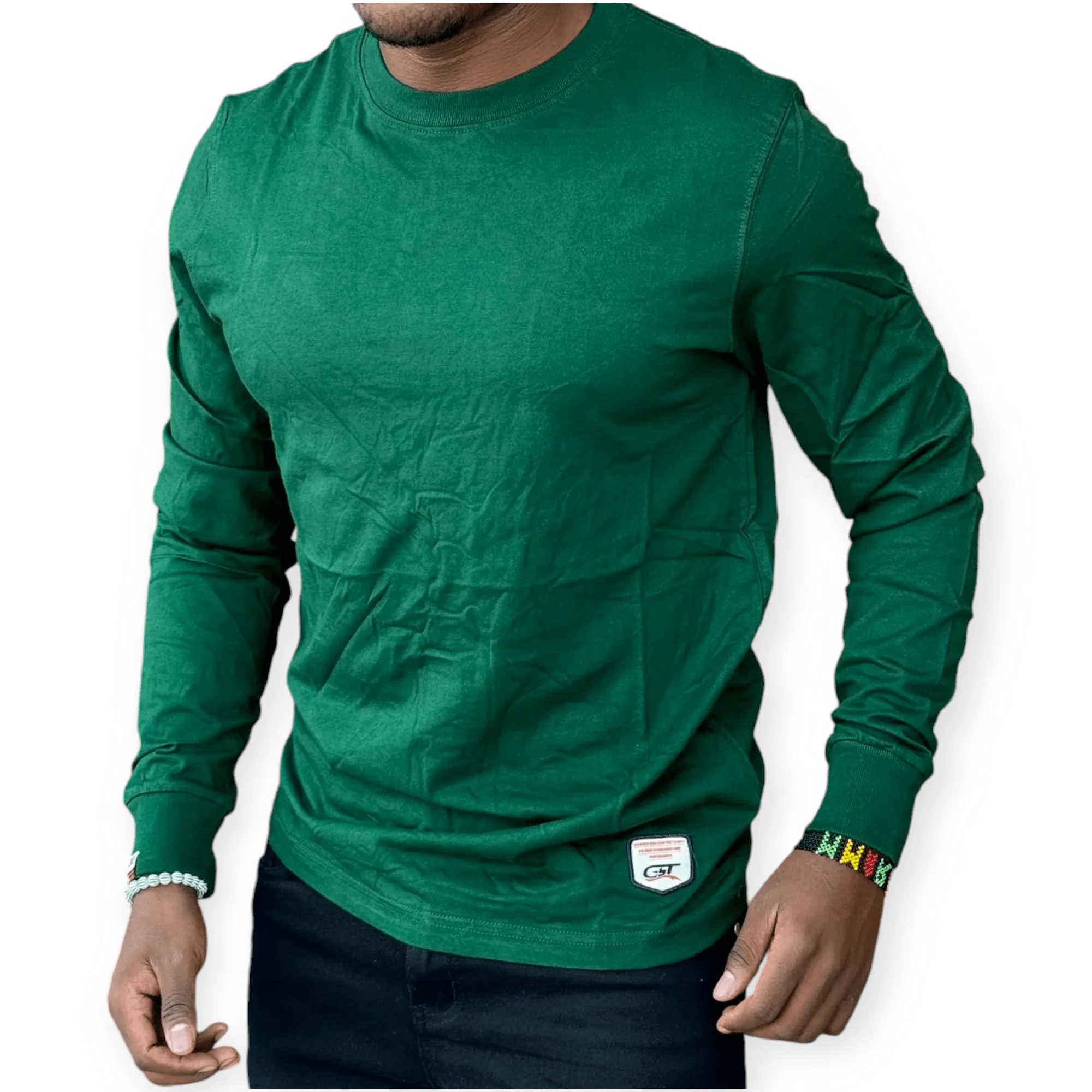 Man wearing a green cotton long sleeve t-shirt with a slim fit, styled casually with dark jeans for everyday wear