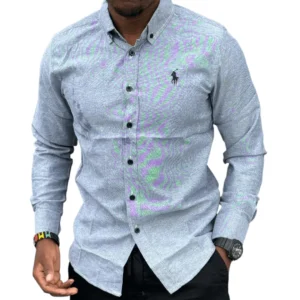 Man wearing a grey cotton polo shirt with long sleeves, button-front design, smart casual fit, and a clean modern look suitable for everyday wear.