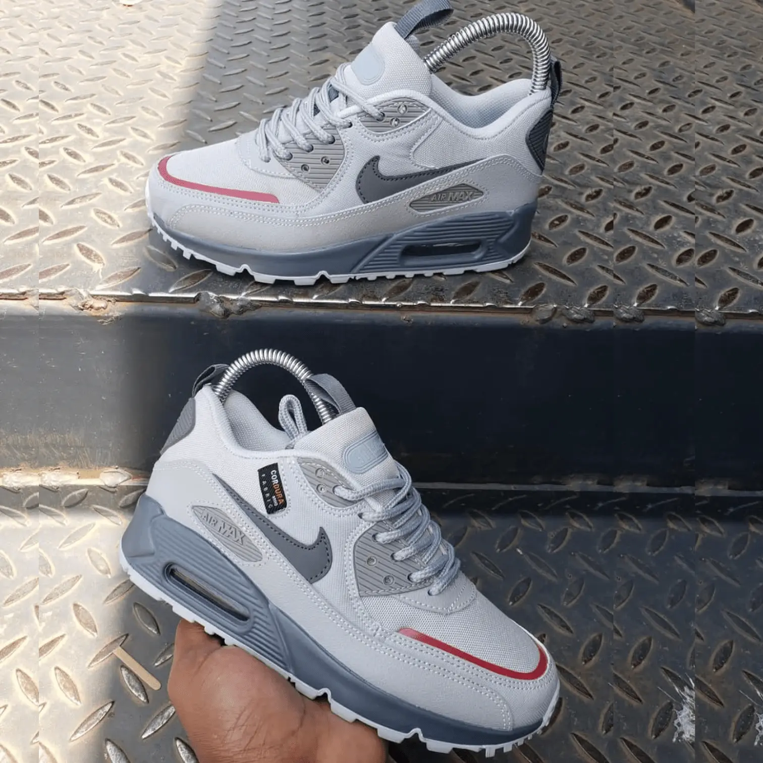 Pair of grey and white Air Max style sneakers with cushioned sole and breathable mesh upper, designed for everyday comfort and casual wear.