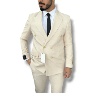 A gentleman wearing a light beige double-breasted suit with subtle pinstripes over a white shirt, paired with a black tie.