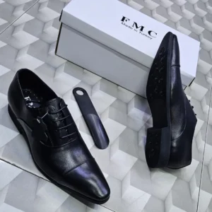 Pair of men’s black genuine leather Oxford shoes with lace-up design and rubber sole, ideal for office and formal wear