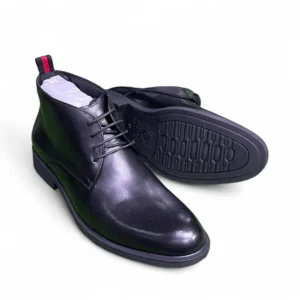 Men’s black leather ankle boots with lace-up design and durable rubber sole displayed on a white background