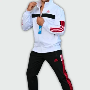 Man wearing a Adidas elite sports tracksuit set with white zip-up jacket and black jogger pants featuring stripe detailing for athletic and casual wear