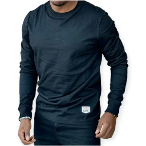 Men wearing a black cotton long sleeve t-shirt with a slim fit, styled casually with dark jeans for everyday wear