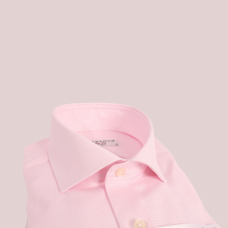 Folded pink Sorrento non-iron slim fit dress shirt with cutaway collar and wrinkle-free label, neatly displayed on a white background with brand tag visible.