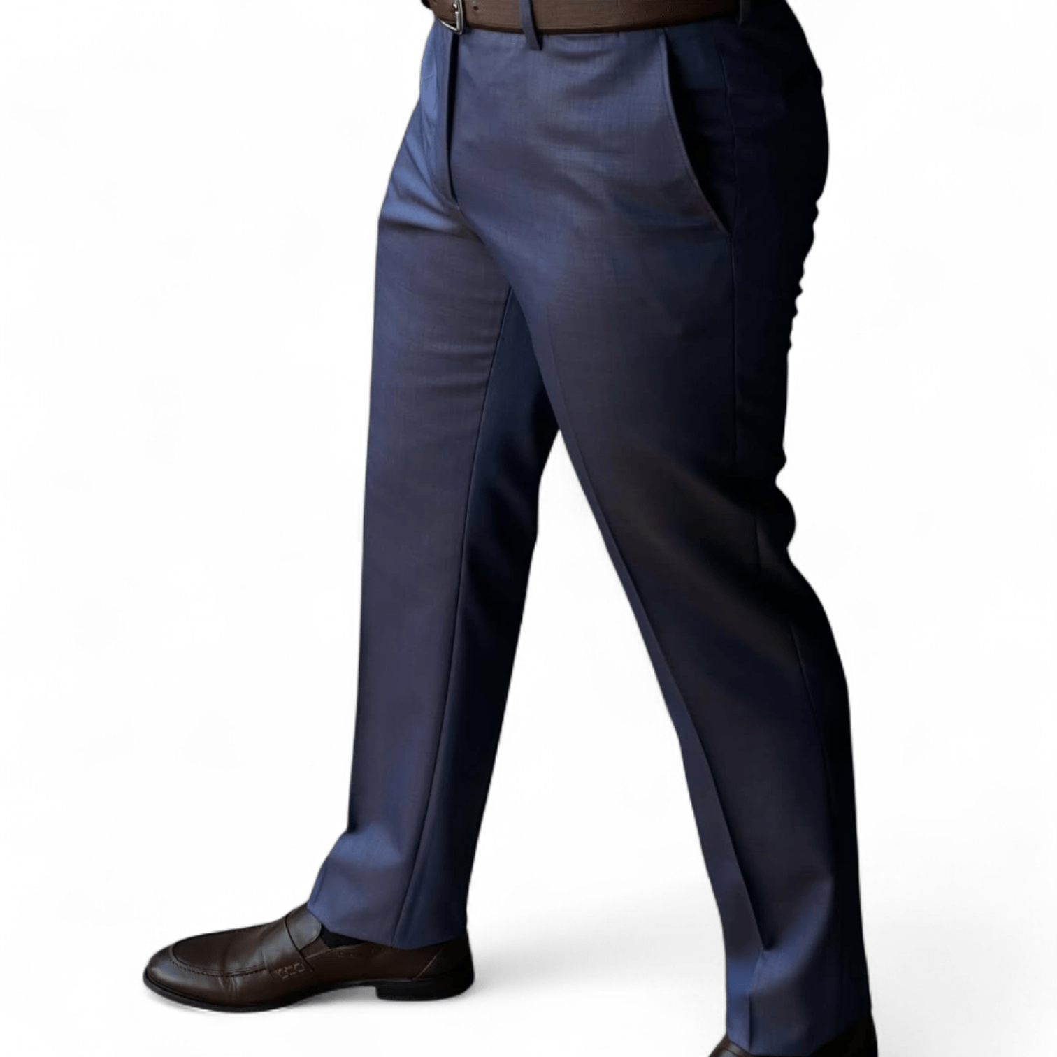 Man wearing navy blue slim fit formal pants paired with brown leather dress shoes on a clean white background.