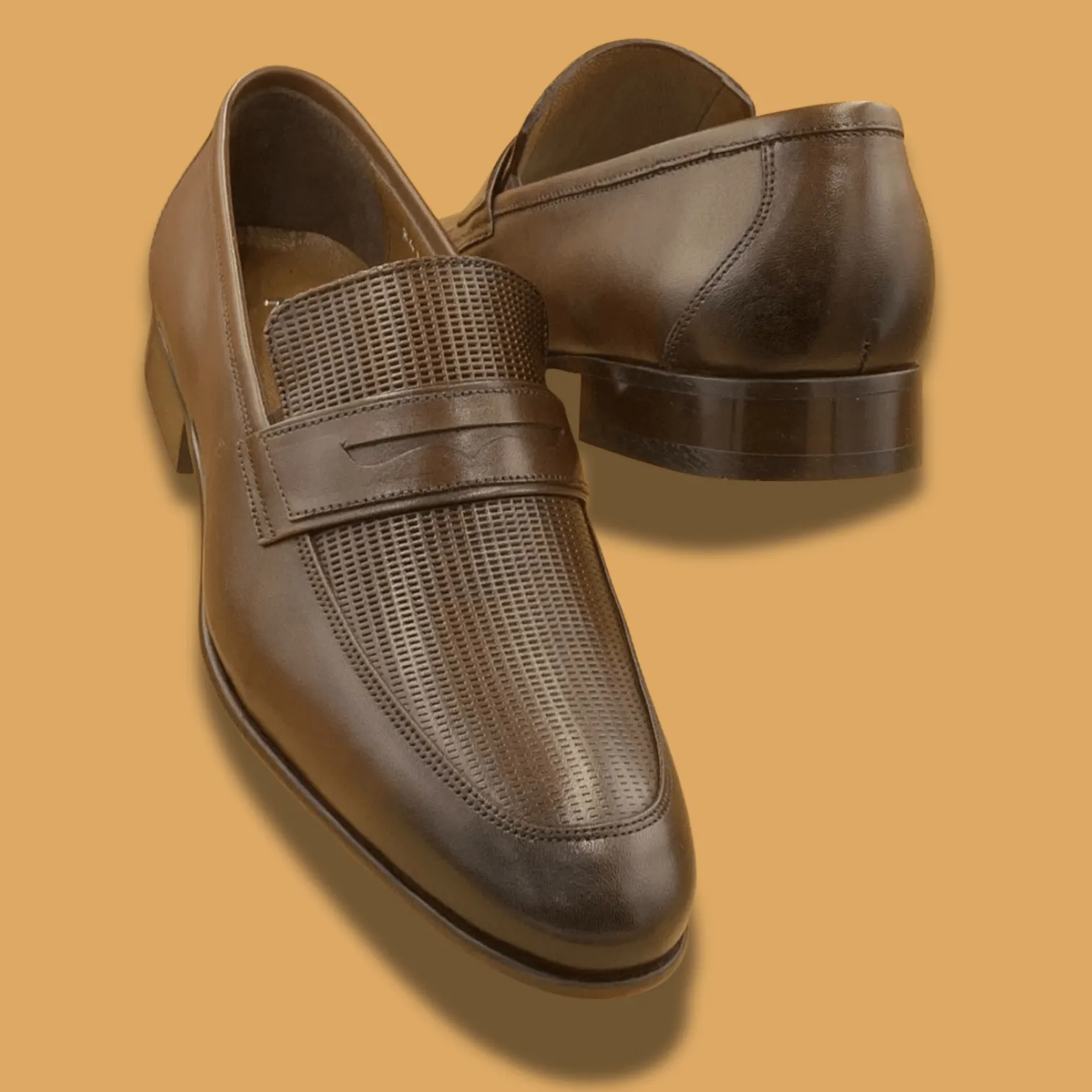 Pair of men’s coffee brown Pampa genuine leather shoes. Loafers with smooth finish and leather sole, designed for formal and office wear