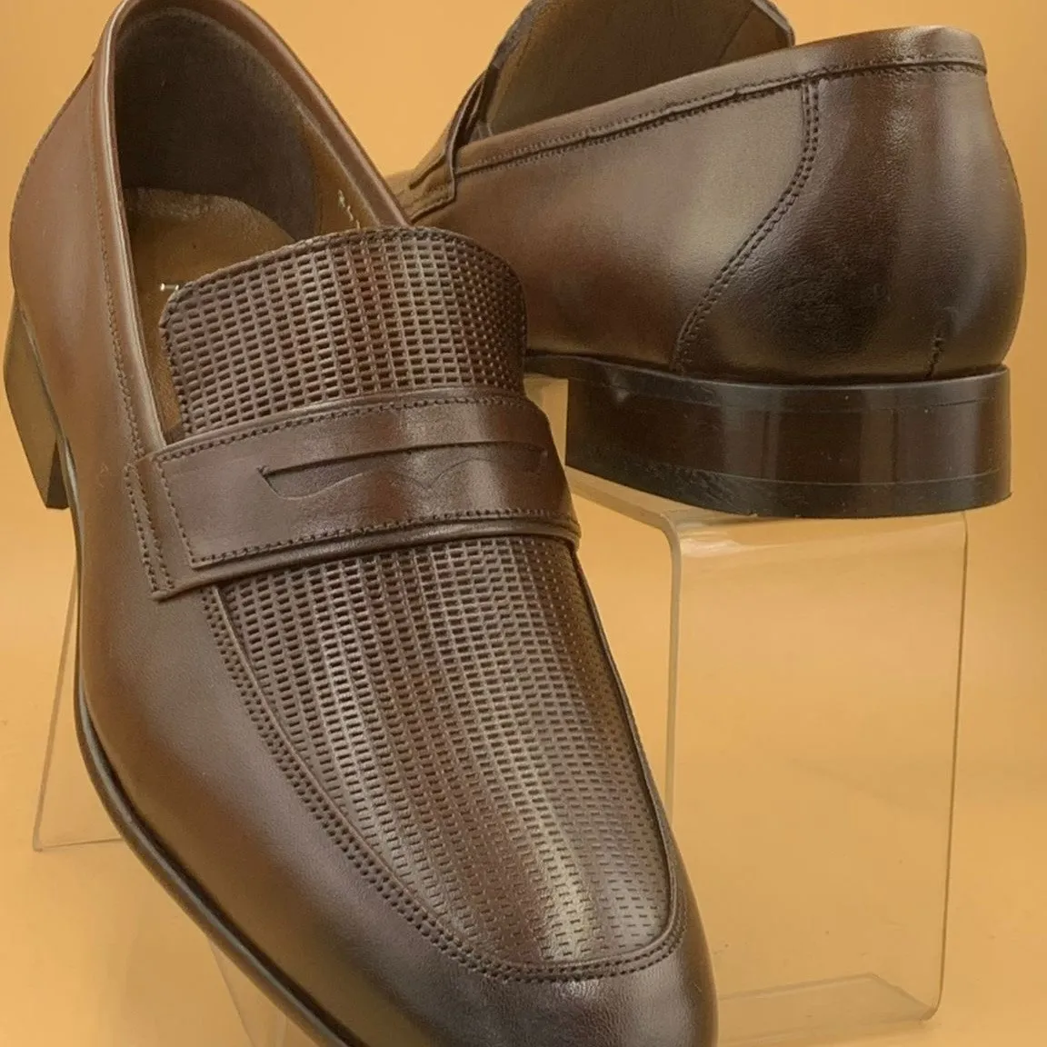 Pair of men’s coffee brown Pampa genuine leather shoes. Loafers with smooth finish and leather sole, designed for formal and office wear