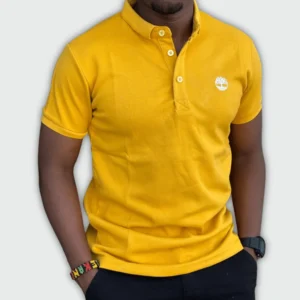 Man wearing a cotton classic yellow polo t-shirt with short sleeves and slim fit, featuring a classic collar and button placket for smart-casual style