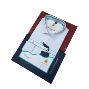 Men’s tailored fit milky white dress shirt folded neatly, featuring a classic collar, buttoned cuffs, and premium cotton fabric for office and business wear.