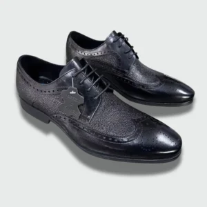 Pair of men’s black genuine leather brogue shoes with lace-up design, textured finish, and rubber sole for office and formal wear