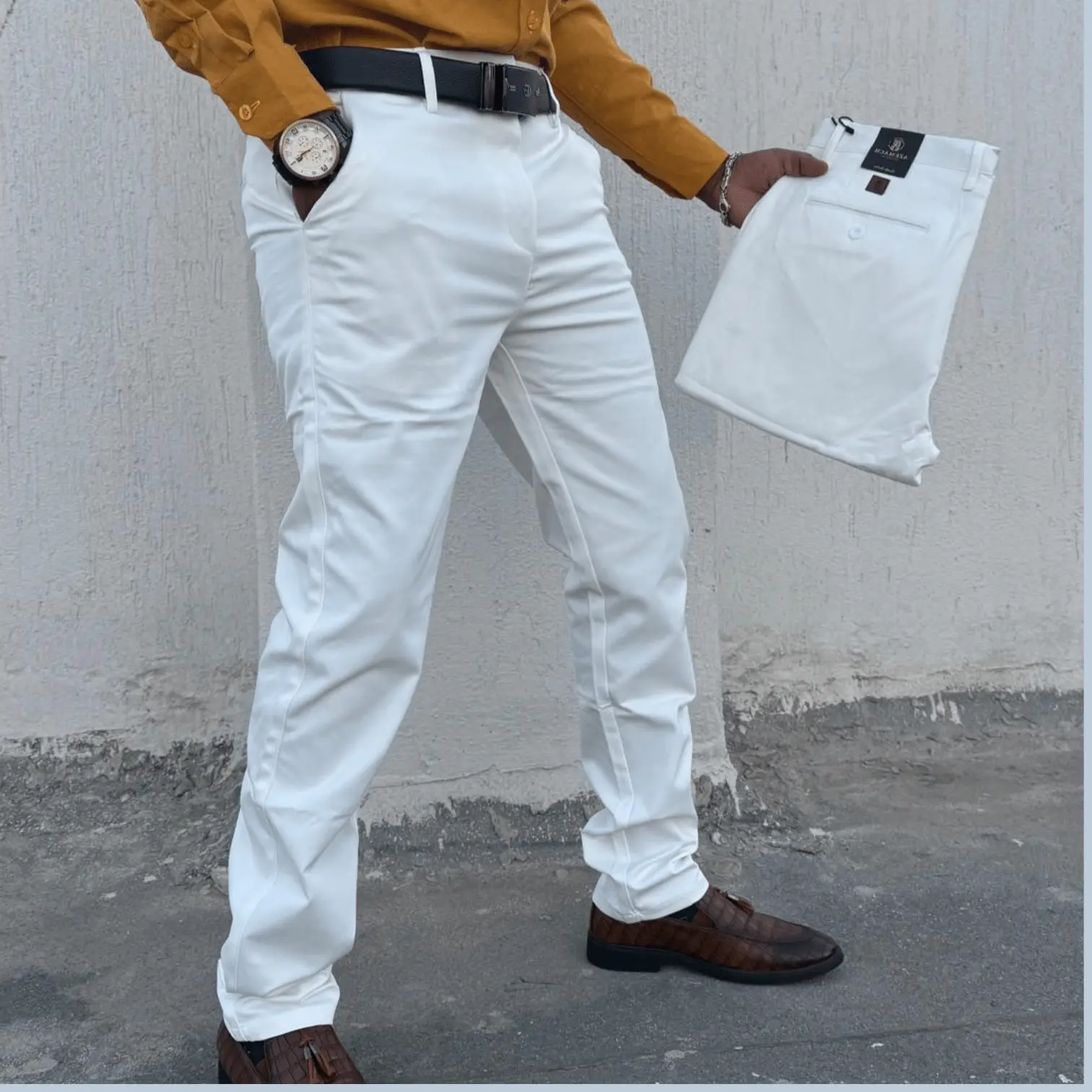 Man wearing soft white khaki slim fit trousers made from soft non-fade fabric, styled for smart casual, office, and everyday wear.