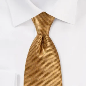 Men’s rich gold textured necktie with a fine woven pattern, neatly knotted and worn with a crisp white dress shirt for a polished formal look.