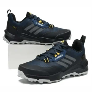 Men’s Adidas Terrex trail sneakers in navy with rugged rubber sole, outdoor athletic shoes designed for hiking, walking, and trail running.
